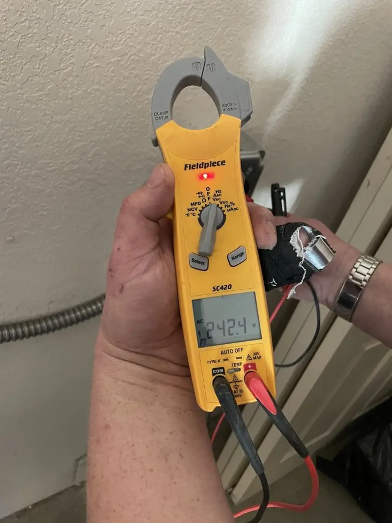 Voltage testing with clamp meter during Generator Installation in Tontitown